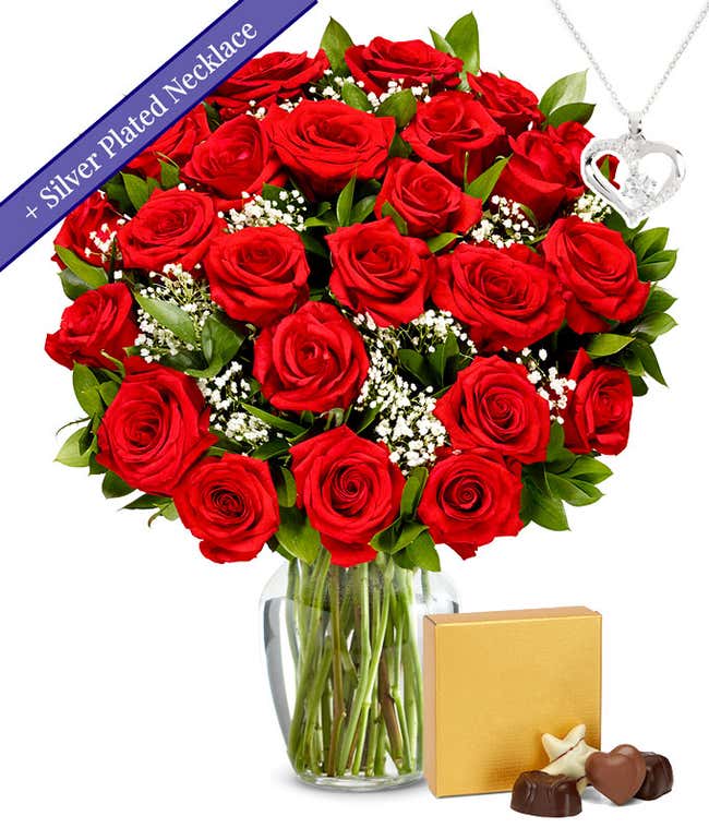 Two dozen red roses with a silver heart necklace on a chain and a small box of assorted chocolates
