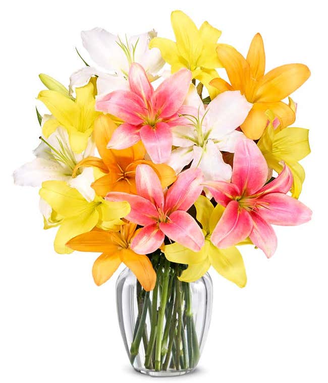 A vibrant floral arrangement featuring pink lilies, orange lilies, and yellow lilies.
