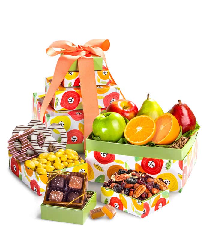 Springtime Gift Tower: Includes Green D'Anjou Pear, Red D'Anjou Pear, Navel Orange, Braeburn Apple, Granny Smith Apple, Gourmet Brownies, Cherry Berry Trail Mix, Lemon Crème Almonds, and Milk & Dark Chocolate Sea Salt Caramels.