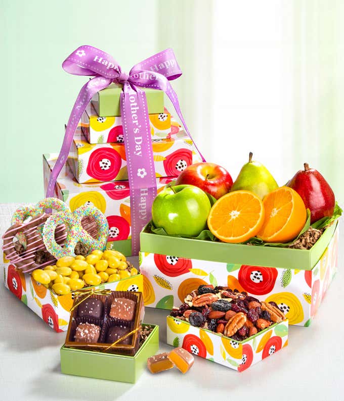 Mother's Day Gift Basket: Green D'Anjou Pear, Red D'Anjou Pear, Navel Orange, Braeburn Apple, Granny Smith Apple, Gourmet Brownies, Cherry Berry Trail Mix, Lemon Crème Almonds, Milk & Dark Chocolate Sea Salt Caramels. Adorned with a 