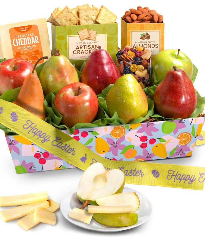Easter gift basket with cheddar cheese, green and red pears, red and green apples, almonds, and crackers in a gift basket with a Happy Easter Ribbon